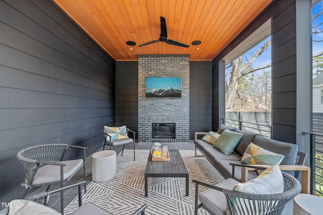 view of patio / terrace with ceiling fan and an outdoor living space