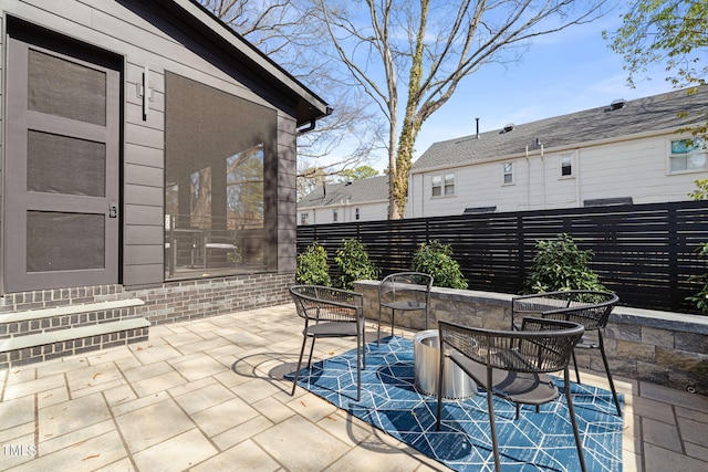 view of patio / terrace featuring fence and outdoor dining space