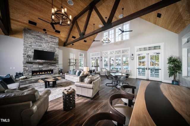 living area with wooden ceiling, a fireplace, wood finished floors, and french doors