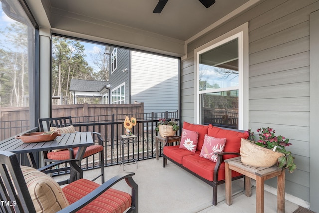 sunroom with a ceiling fan