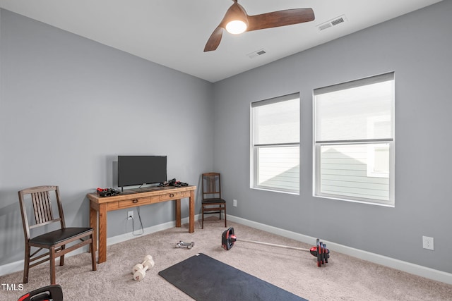 workout room with carpet floors, baseboards, and visible vents