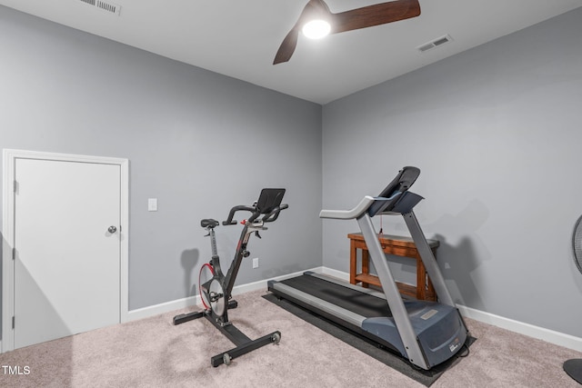 workout area with carpet, visible vents, and baseboards