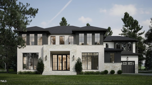 view of front of property featuring a front lawn, stone siding, brick siding, and an attached garage