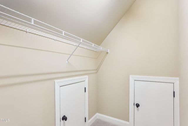 washroom with baseboards