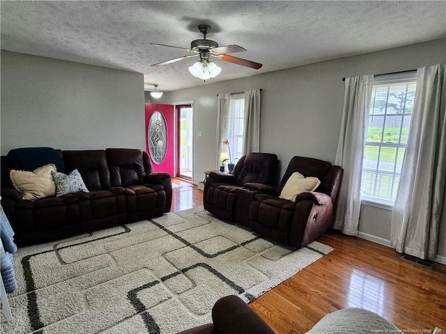 11 Scotland Dr, Spring Lake, NC 28390 - living area featuring visible vents, ceiling fan, wood finished floors, and a healthy amount of sunlight