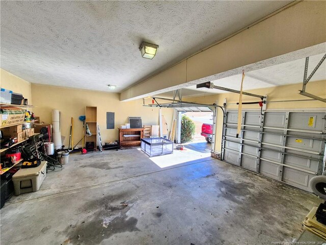 11 Scotland Dr, Spring Lake, NC 28390 - garage with electric panel and a garage door opener