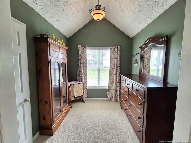11 Scotland Dr, Spring Lake, NC 28390 - bedroom featuring baseboards, light colored carpet, vaulted ceiling, and a textured ceiling
