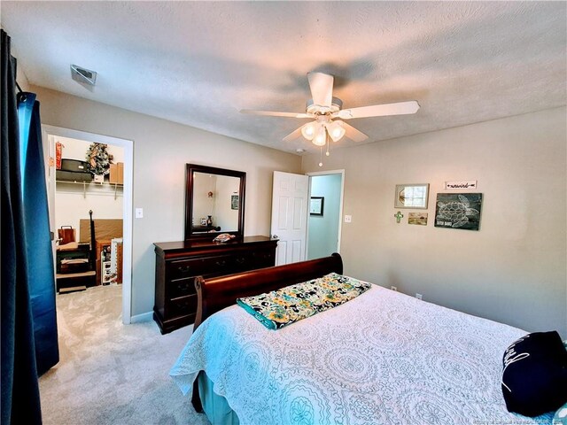 11 Scotland Dr, Spring Lake, NC 28390 - carpeted bedroom featuring a spacious closet, visible vents, and a ceiling fan
