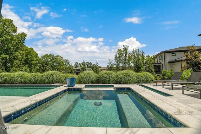 outdoor pool featuring a patio area