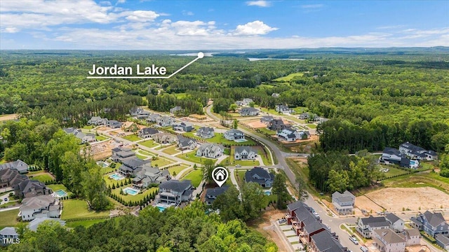 aerial view with a wooded view and a residential view