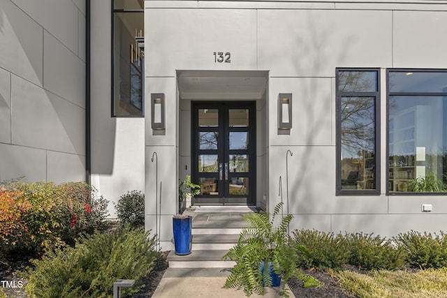 doorway to property with stucco siding and french doors