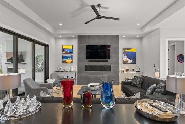 living room with recessed lighting, a ceiling fan, and wood finished floors