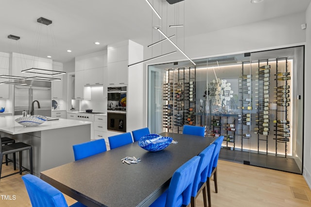 dining room with visible vents, recessed lighting, and light wood-type flooring