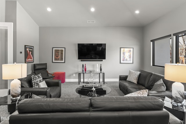 carpeted living room featuring recessed lighting, visible vents, and baseboards