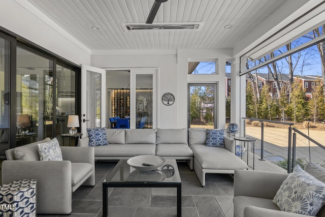 sunroom featuring visible vents and wood ceiling