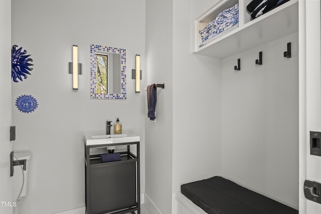 mudroom with a sink