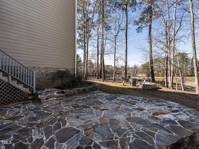 view of patio / terrace featuring fence