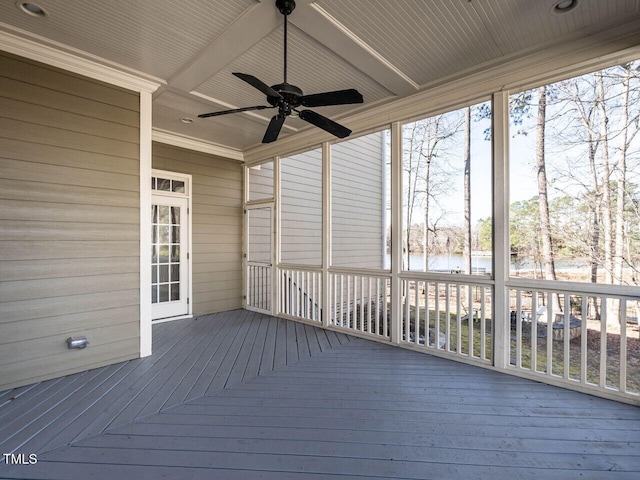 wooden terrace featuring a water view and ceiling fan