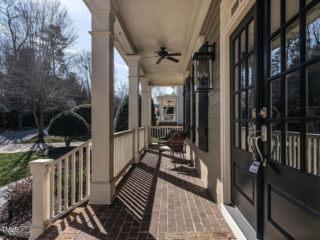 exterior space with covered porch and ceiling fan