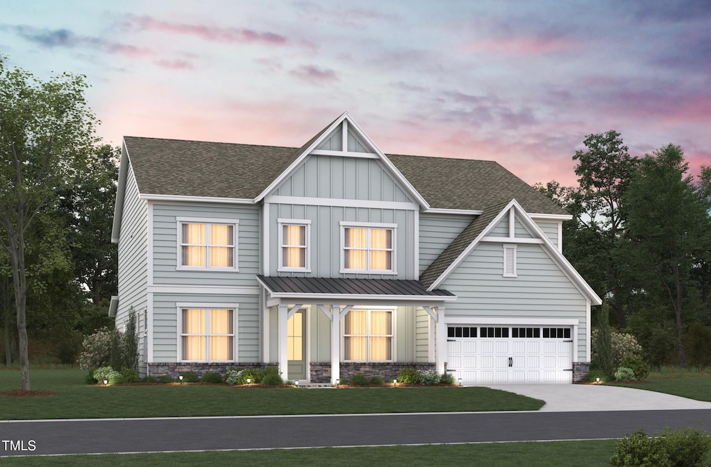 view of front of house with driveway, roof with shingles, a standing seam roof, a front lawn, and board and batten siding