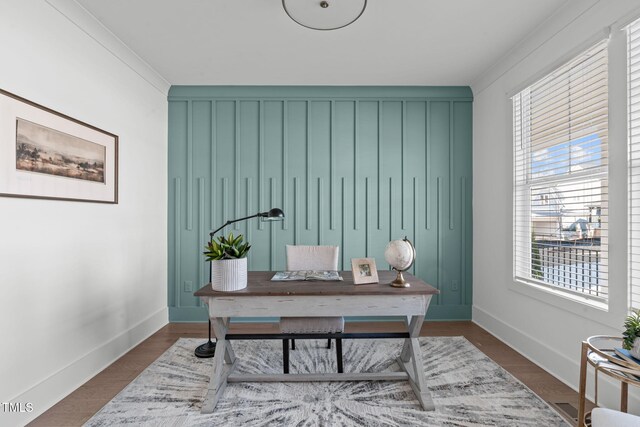 office featuring baseboards and wood finished floors