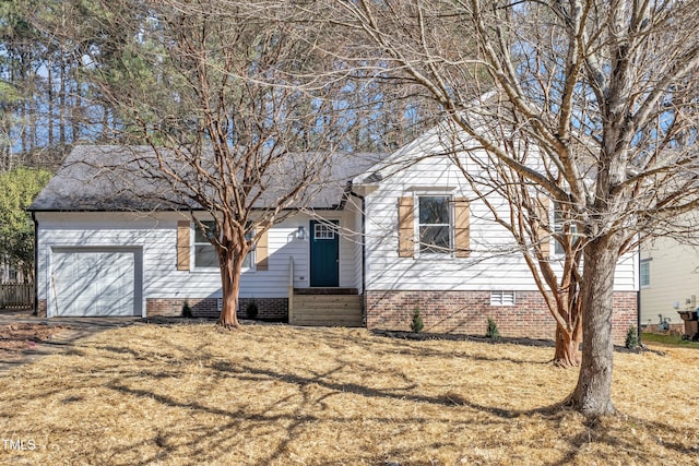 view of front of property featuring a front yard, crawl space, and an attached garage