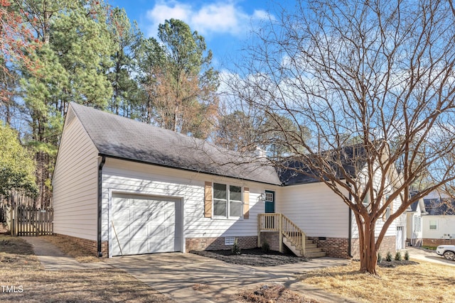 view of front of house featuring a shingled roof, concrete driveway, crawl space, fence, and a garage