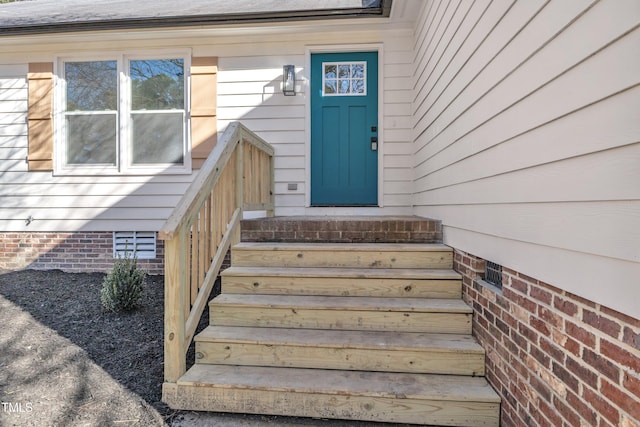 doorway to property featuring crawl space