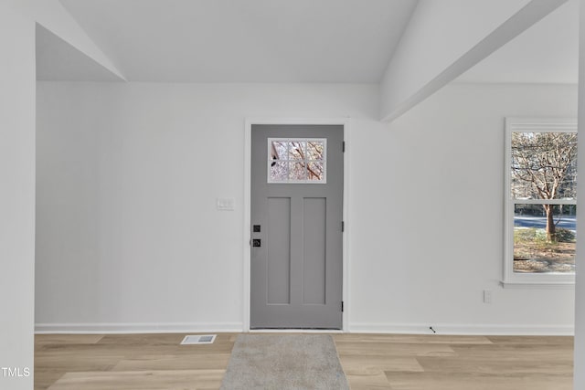 entrance foyer featuring light wood-style floors and baseboards