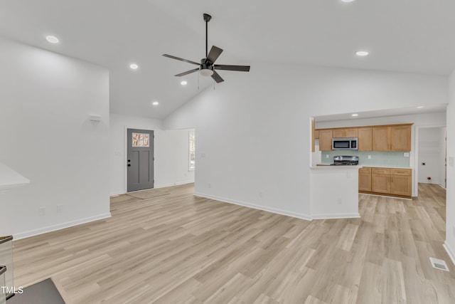 unfurnished living room featuring baseboards, a ceiling fan, light wood-type flooring, high vaulted ceiling, and recessed lighting