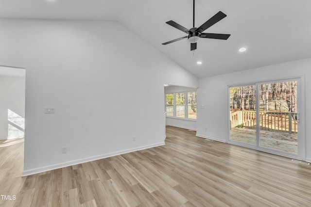 interior space featuring recessed lighting, light wood-style flooring, a ceiling fan, high vaulted ceiling, and baseboards