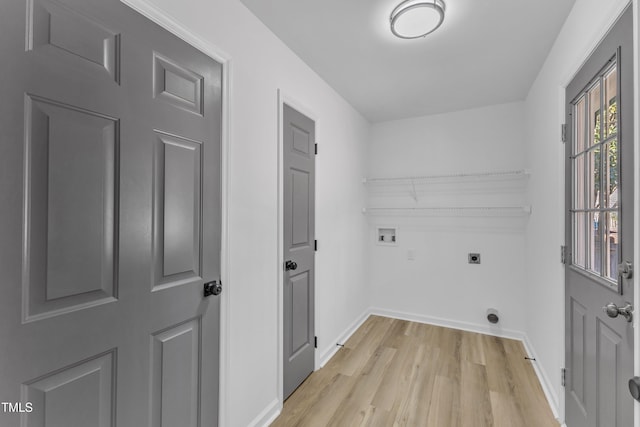 laundry area with washer hookup, light wood-style floors, hookup for an electric dryer, laundry area, and baseboards