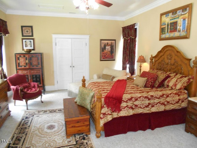 carpeted bedroom featuring ornamental molding, a ceiling fan, and baseboards