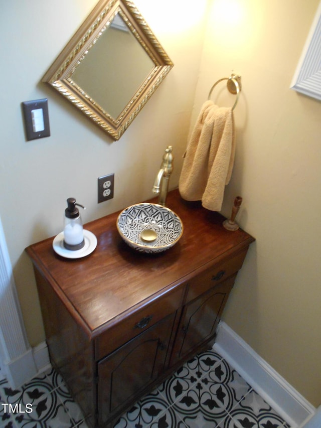 bathroom featuring baseboards and tile patterned floors