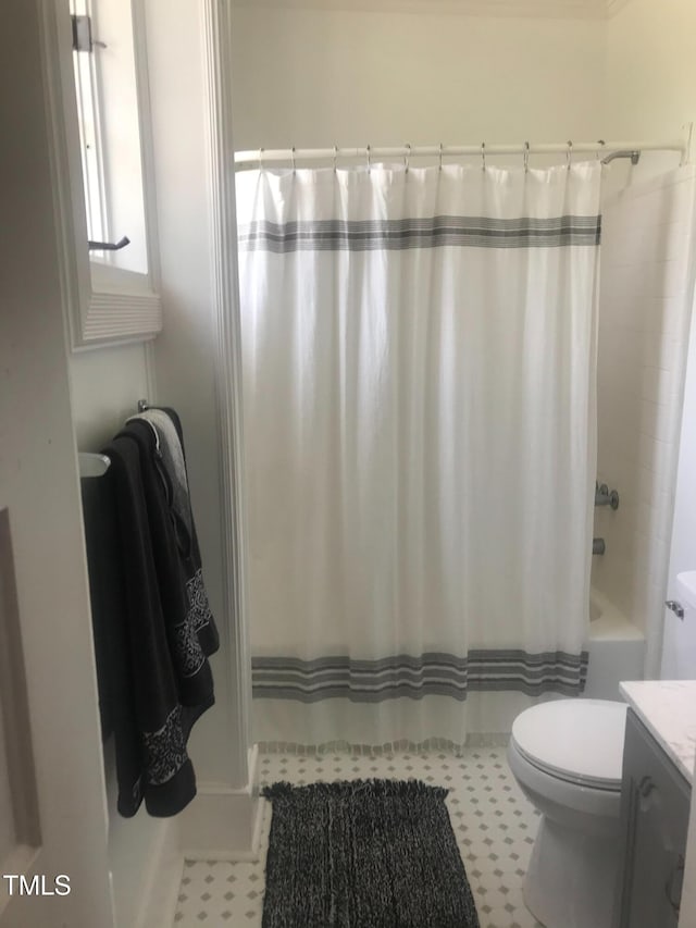 full bath with toilet, shower / bath combo, and vanity