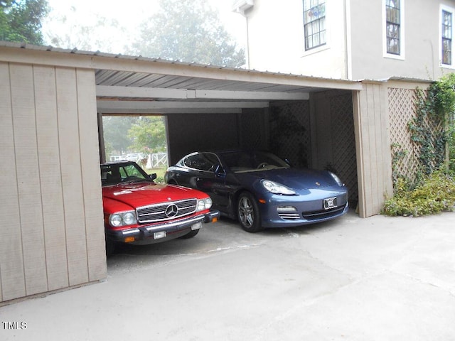 view of parking featuring an attached carport