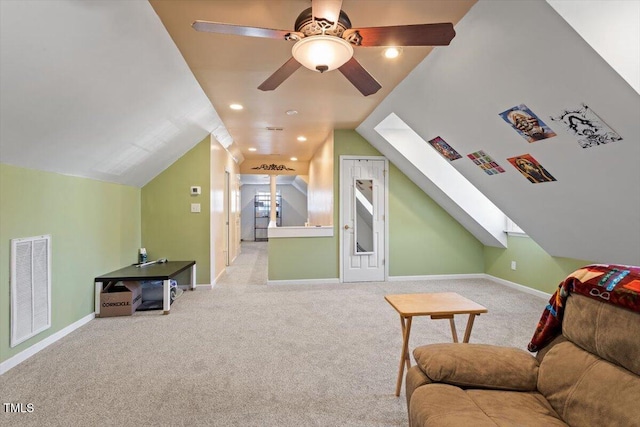 interior space with lofted ceiling, baseboards, visible vents, and light colored carpet