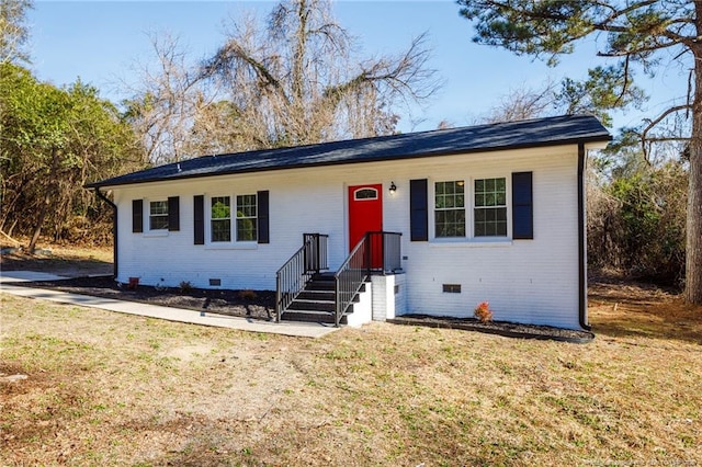 single story home featuring a front yard, crawl space, and brick siding