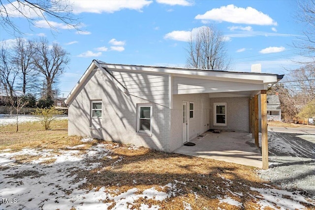 exterior space with brick siding