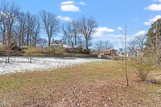 view of yard with a residential view and fence