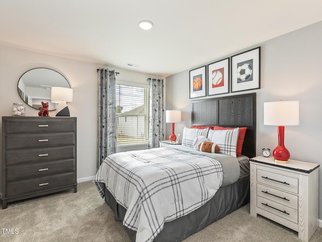 bedroom featuring light carpet, baseboards, and visible vents