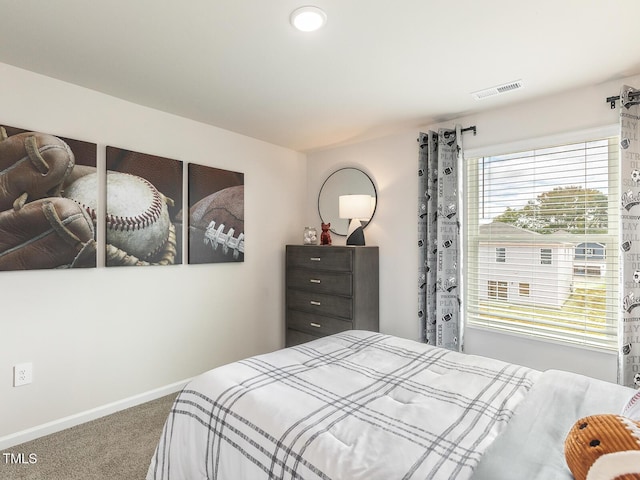 bedroom featuring carpet floors, visible vents, and baseboards