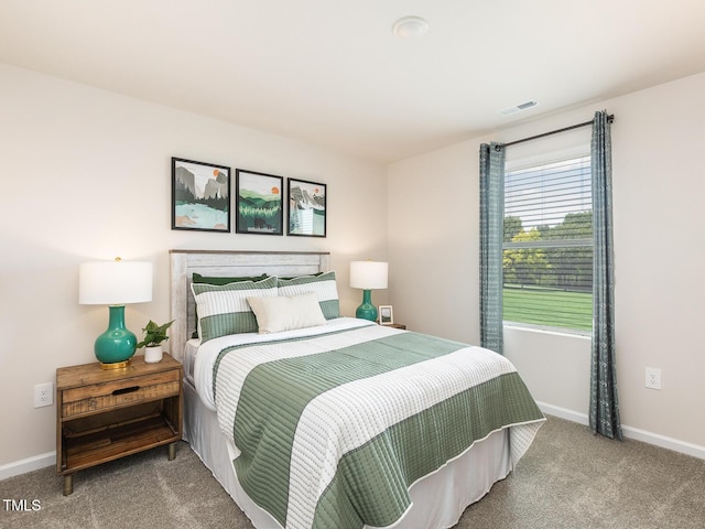 bedroom featuring carpet flooring, visible vents, and baseboards