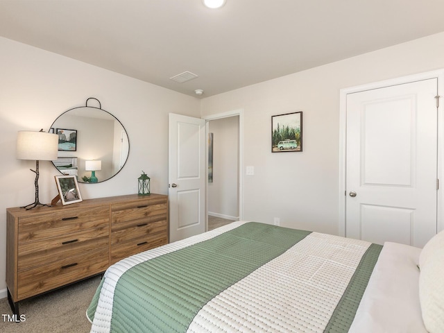 carpeted bedroom with visible vents