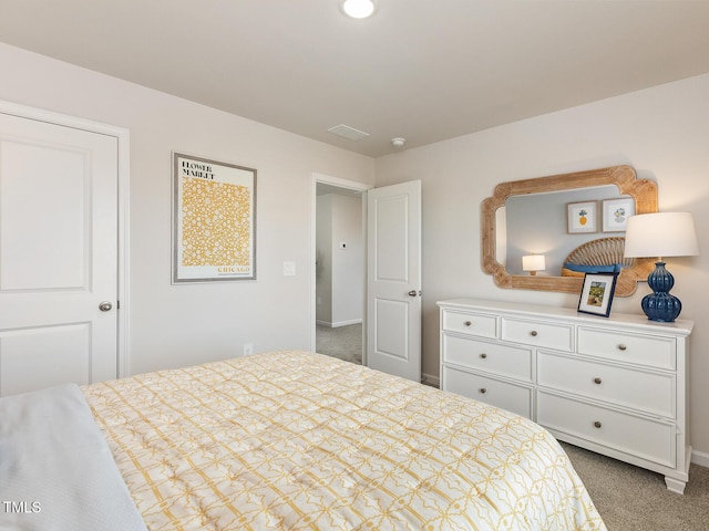 bedroom featuring carpet floors, visible vents, and baseboards