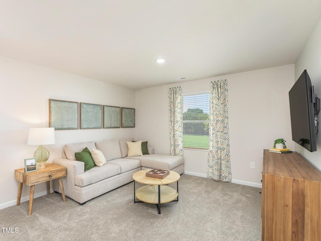 living area featuring carpet, baseboards, and recessed lighting