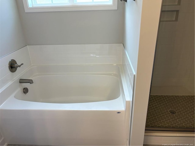 62 Peach Orchard Ln, Lillington, NC 27546 - full bathroom featuring plenty of natural light, a garden tub, and a shower stall