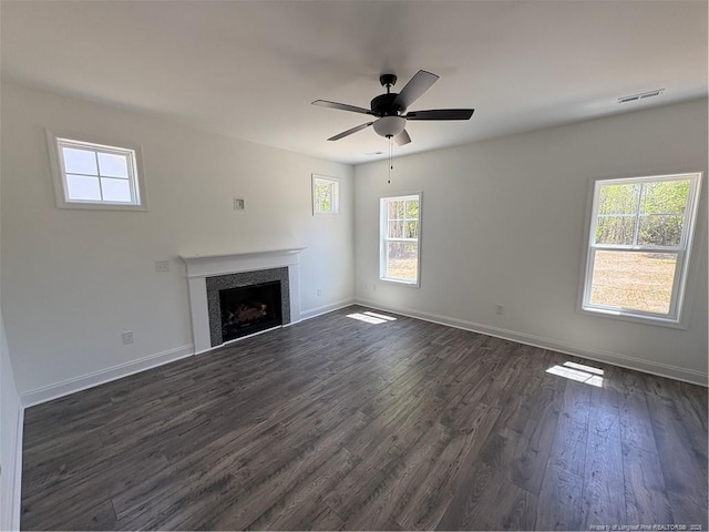 22 Peach Orchard Ln, Lillington, NC 27546 - unfurnished living room featuring dark wood-type flooring, baseboards, and a fireplace