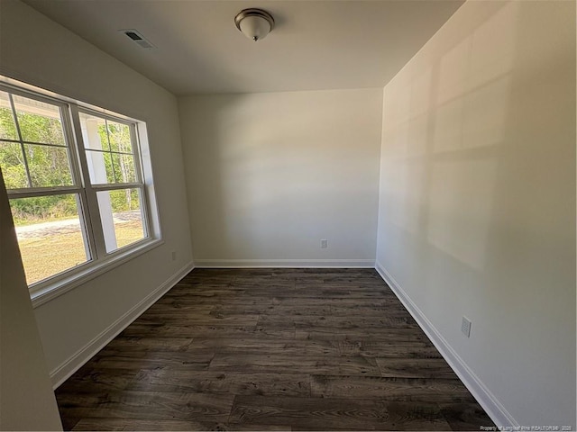 22 Peach Orchard Ln, Lillington, NC 27546 - empty room featuring dark wood-style flooring and baseboards