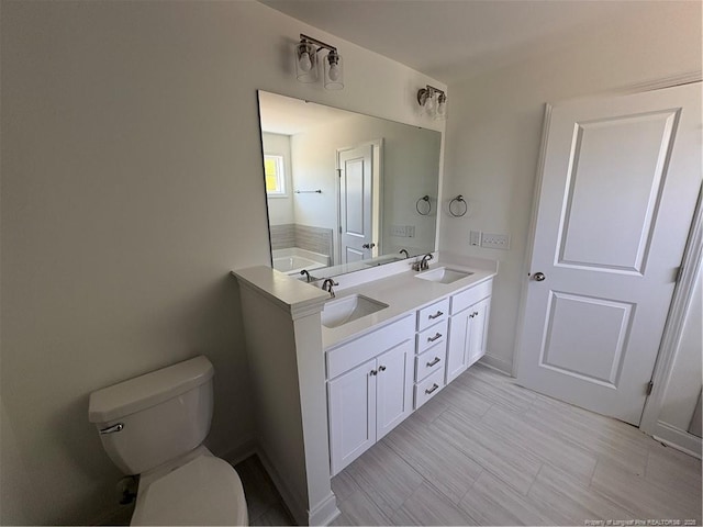 22 Peach Orchard Ln, Lillington, NC 27546 - full bath with toilet, double vanity, and baseboards
